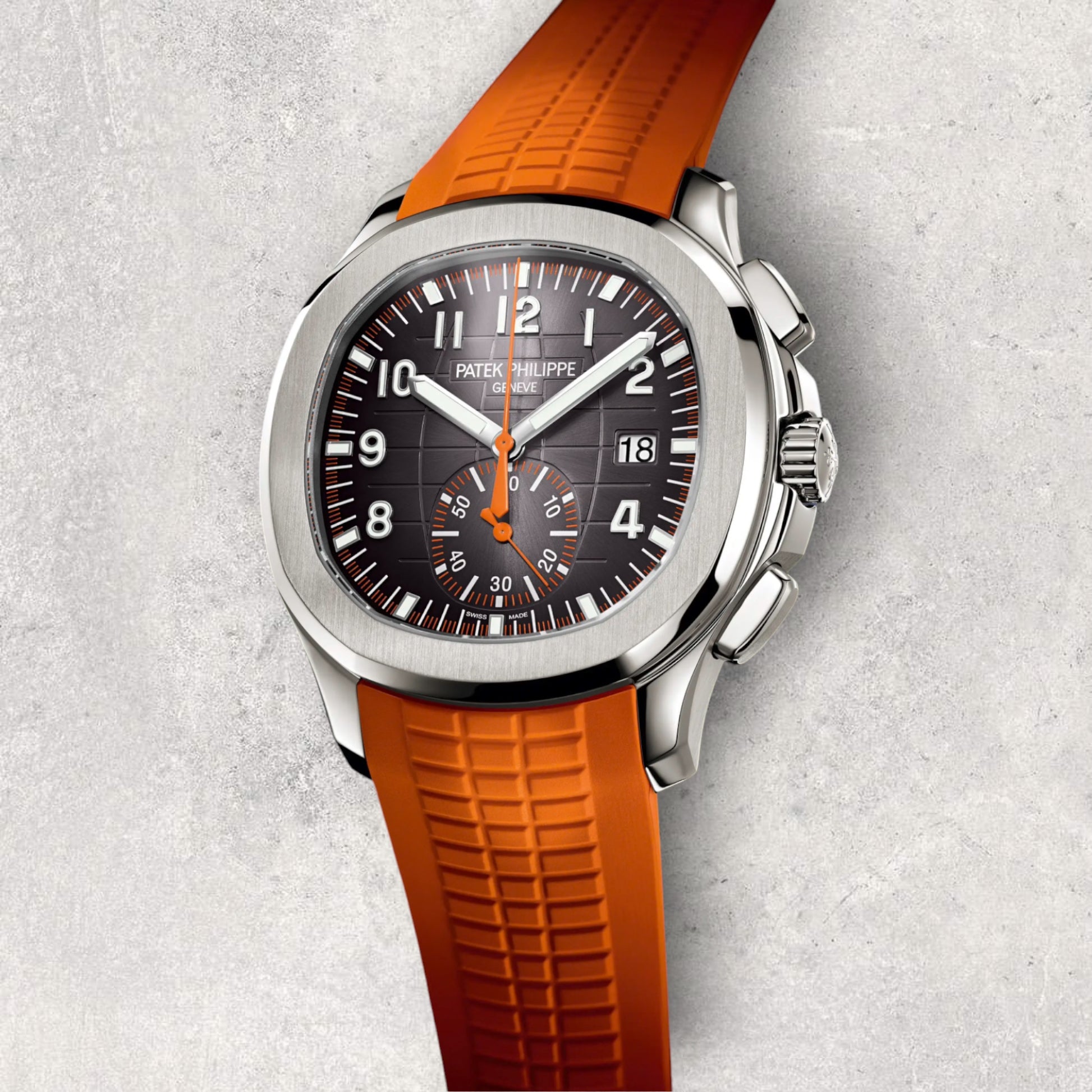 Patek Philippe Aquanaut 5968A-001 close-up showing intricate black dial chronograph sub-dials and textured orange rubber strap