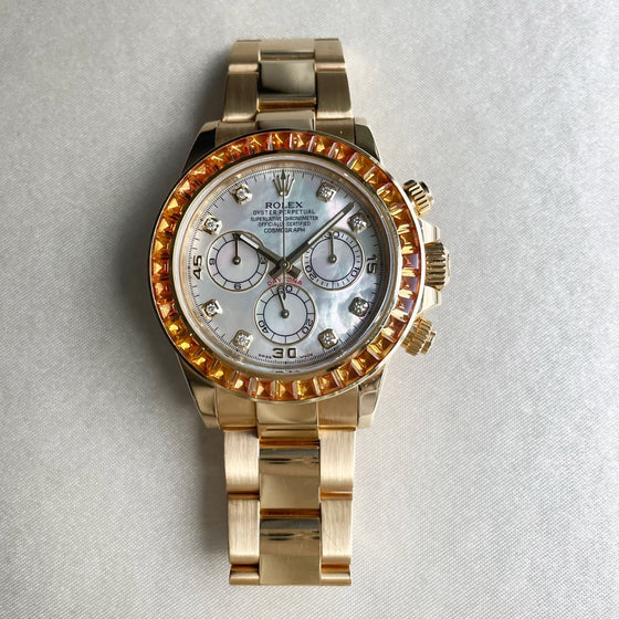 Rolex Daytona Yellow Gold Mother of Pearl Diamond Dial Orange Baguette Sapphires Bezel 116578SACO