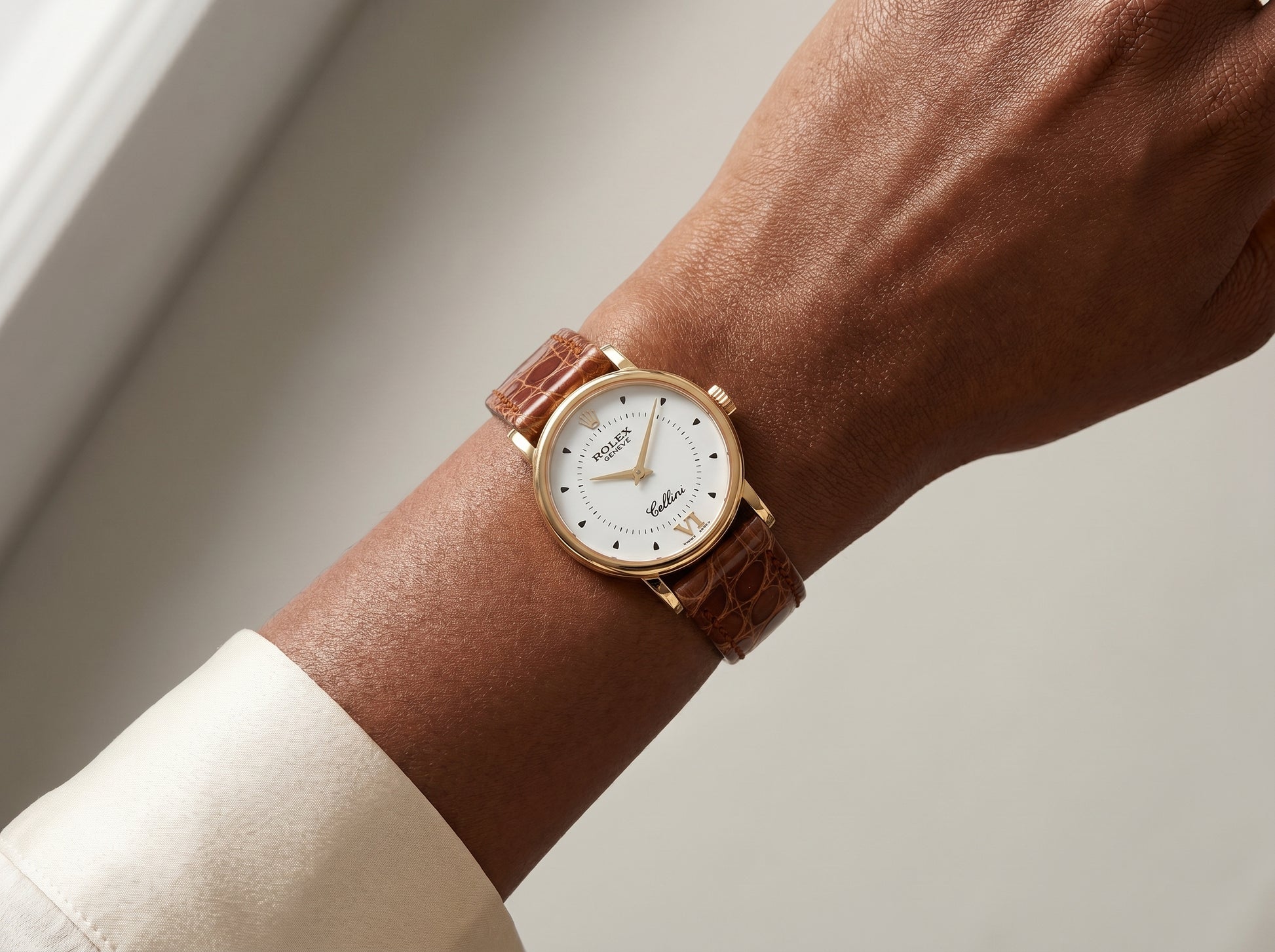 Rolex Cellini Quartz 6110-8 26mm Yellow Gold White Dial Roman Numerals Brown Leather — lifestyle wrist close-up